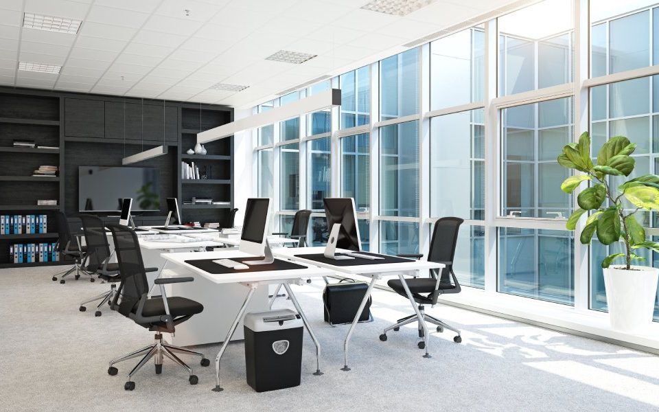 An office space for a business. The office includes a conference table and rolling desk chairs for comfort.